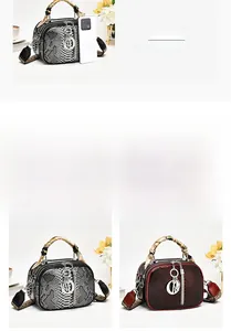 Detailed comparison of gray and burgundy python print leather bags with silk scarves and metal D charms