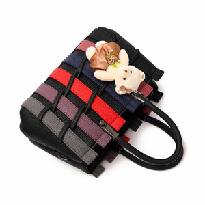 Women's black pebbled leather woven handbag with colorful stripes and bear pendant