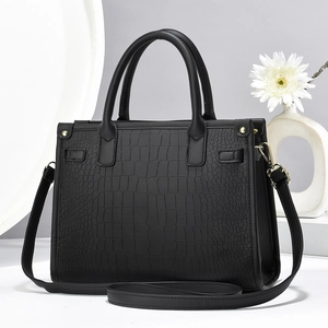 Elegant black crocodile-pattern tote bag set with golden hardware and shoulder strap