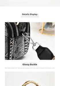 Close-up of polished silver hardware hook on luxury python-patterned leather handbag