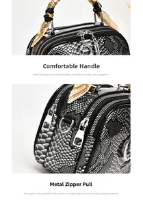 Detail of snake skin texture handbag with silk scarf handle and silver polished hardware