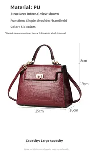 Detail view of burgundy crocodile pattern handbag with size dimensions 25x19x10cm