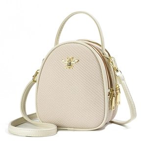 Beige mini egg-shaped crossbody bag with woven texture and golden bee metal hardware