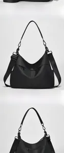Vorder- und Rückansicht einer schwarzen Nylontasche mit Gurt und Reißverschlusstasche