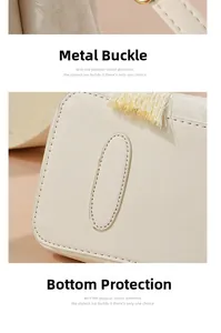 Gros plan sur la boucle métallique et les clous de protection d'un sac à main en cuir