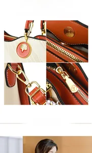 Detail of premium golden hardware and logo pendant on orange beige tote bag