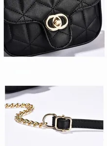 Close-up of golden hardware lock and diamond quilted texture on black shoulder bag