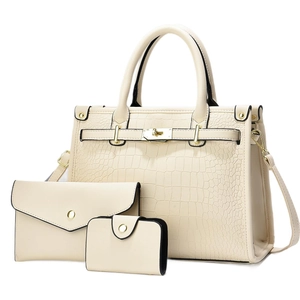 Three-piece beige crocodile pattern tote bag set with envelope clutch and small wallet