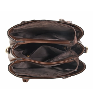 Contrast color tote bag with three compartments and golden hardware in overhead view