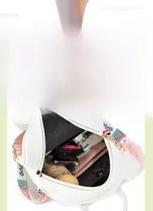 Detailed interior view showing spacious compartments and storage of the white rabbit backpack