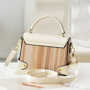 Chic woven stripe top handle crossbody bag with contrast leather and gold turn-lock closure