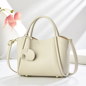 Sac À Main Seau Pour Femmes Couleur Unie Cuir PU Motif Lychee Avec Charme Éléphant Sac À Bandoulière Chic Minimaliste