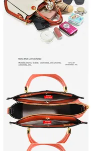Detailed interior of embossed tote bag showing spacious compartments and scarf handle