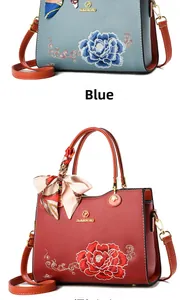 Detailed embroidery of large floral patterns on premium leather handbags with silk scarves
