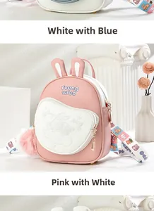 Detail of pink rabbit backpack showing cute bunny ears and star embroidery on soft leather