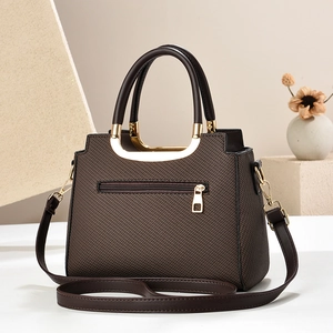 Deep brown textured faux leather tote bag with gold zipper detail and crossbody strap