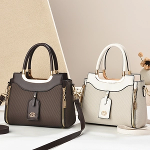 Chic woven leather tote bags in brown and beige with round metal handles and side zippers