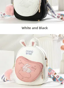 Close-up of cute rabbit embroidery and soft PU leather texture on a girls' backpack