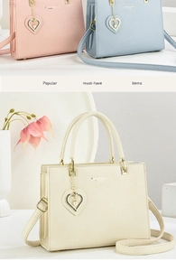 Detail of lychee pattern leather tote bag featuring a heart pearl pendant and brand logo