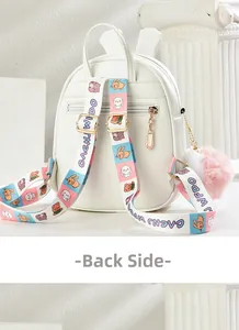 Back view of white mini backpack with cartoon straps, plush pompom, and hidden pocket