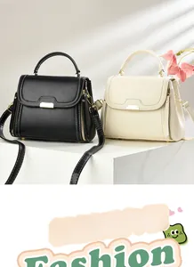 Detail of vintage square handbags in black and beige with gold clasps on geometric stands