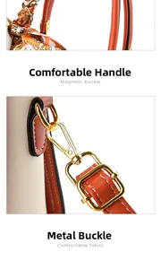 Detail of the litchi grain leather handle wrapped with a floral silk scarf and gold hardware