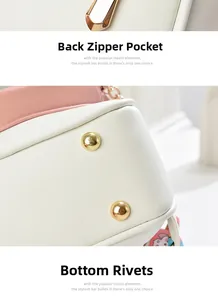 Detail of bunny backpack showing pink edges, back zipper pocket and bottom metal rivets