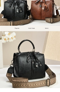 Detail of vintage crossbody bag showing oily wax texture and bohemian jacquard strap