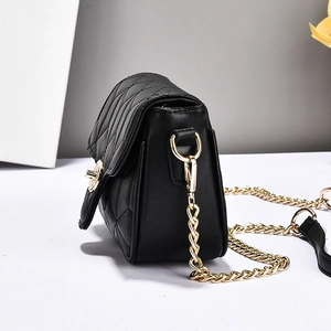 Classic black quilted crossbody bag with gold chain strap shown from a 45-degree angle