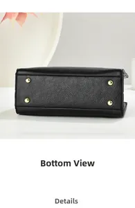 Close-up of black lychee leather handbag base with four golden metal protective studs