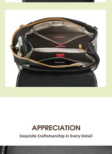 Detail view of the black leather crossbody bag internal compartments and gold hardware
