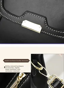Close-up of premium black leather texture with durable gold hardware and precision stitching