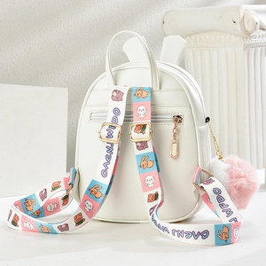 Cute white bunny backpack for girls with cartoon straps and pompom charms on white stand