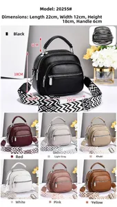 Detail of multi-zipper tote bag with patterned strap and seven color options