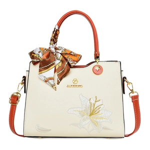 Sac à main blanc crème élégant avec broderie de lys et anses orange sur fond blanc
