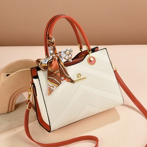 Chic two-tone white and orange leather tote bag with stylish V-shaped wavy texture