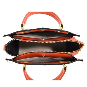Fashionable orange embossed handbag with multi-compartment interior and gold hardware