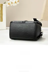 Detail view of the wave-textured leather bottom and solid structure of the black bag