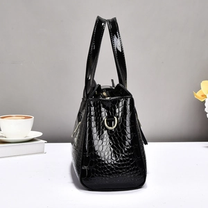 Elegant black crocodile-patterned patent leather handbag with gold-tone hardware for women