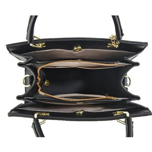 Black leather handbag with three internal compartments and golden metal hardware detail