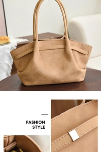 Detail view of large apricot handbag with matte leather texture and gold buckle accents