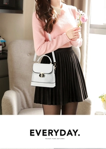 White faux leather crossbody bag with diamond quilting and gold D-ring buckle detail