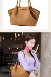 Detail of a large brown suede tote bag with metal buckle and side pleats