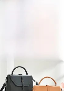 Detail view showing textured carbon fiber embossed side of black and brown messenger bags