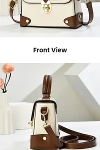 Close-up of retro leather underarm bag with gold lock and vintage two-tone finish