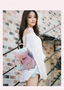 Detail of pink and blue gradient backpack with cherry blossom prints and front pockets