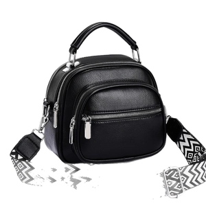 Fashionable black pebbled leather tote bag with multi-layer zippers and wide woven strap