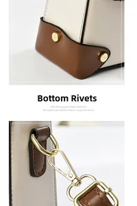 Detail of gold metal rivets on off-white leather bag base and exquisite lobster clasp