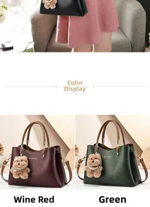 Detail view of burgundy and green leather tote bags with cute plush bear charms