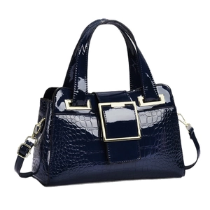 Navy blue faux crocodile leather handbag with gold buckle and detachable strap
